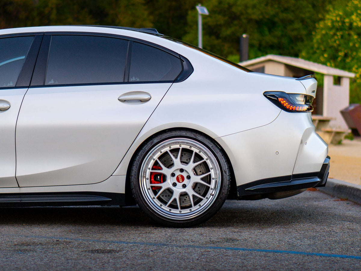 White BMW M3 with silver mesh wheels and red brake calipers